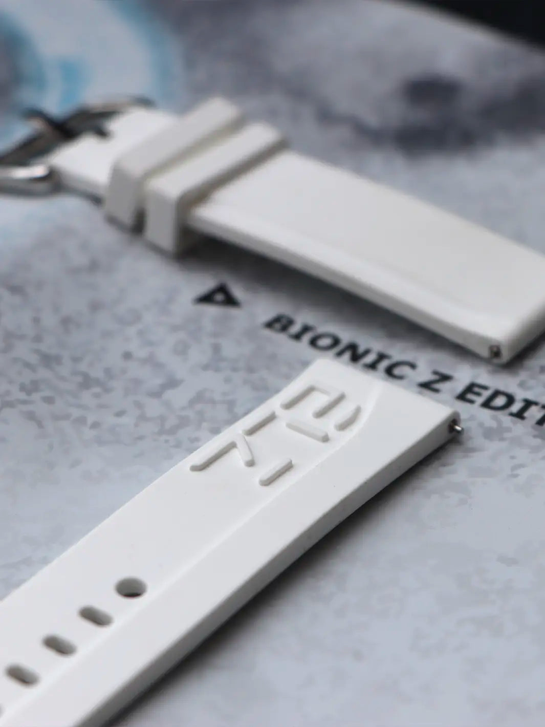 White Embossed Rubber Strap Bionic design // Silver buckle